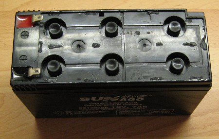 cell sealed lead acid battery with its plastic cover prized off